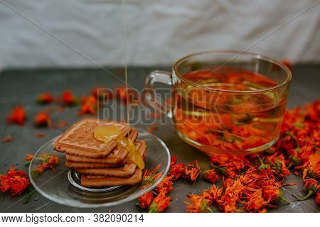 The Honey On Baked Goods. Orange Calendula Flower Tea