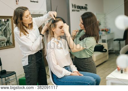 Portrait Of Two Professional Make-up Artist Doing Makeover In Lighting Dressing Room. Concept Of Bac