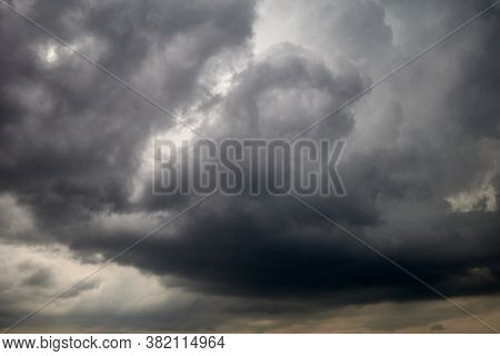 Dramtic Plumbeous Sky With Grey, Yellowed And Black Clouds