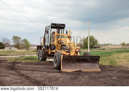 Yellow Bulldozer With Bucket. Wheel Loader. Heavy Equipment Machine. Tractor Front Loader. Construct