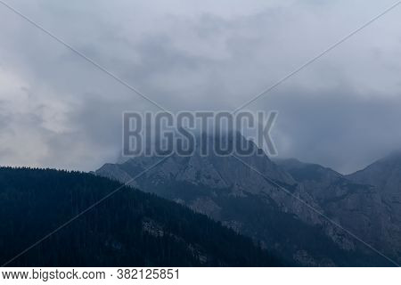 Misty Fog After Rain On Austia Alps Mountain With Sky