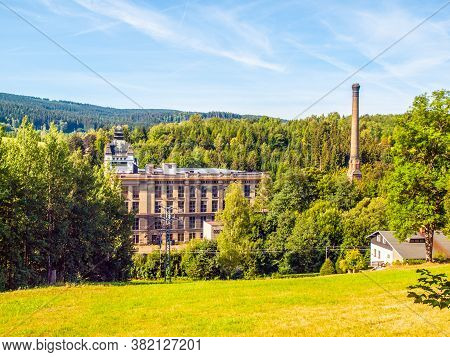 Old Textile Factory Called Klaster, Monastery, With High Chimney In Summer Time, Tanvald, Northern B