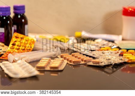 Medicines And Medicines. Pack Of Pills Spread On A Flat Surface. Health Health. Bottles And Packagin