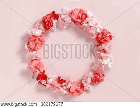Frame Of Pink Flowers Over A Pink Background  Top View