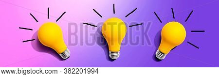 Three Yellow Light Bulbs - Flat Lay From Above