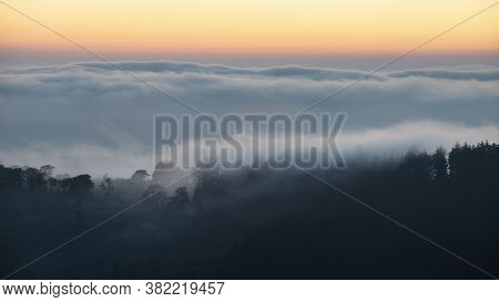 Majestic Landscape Image Of Cloud Inversion At Sunset Over Dartmoor National Park In Engand With Clo