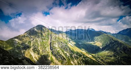 Misty Fagaras Mountains, Romania. Mist Over The Alps Of Transylvania.