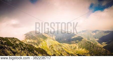 Misty Fagaras Mountains, Romania. Mist Over The Alps Of Transylvania.