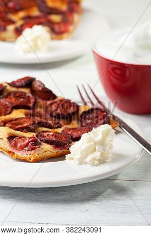 Slice Of Bavarian Plumcake With Cream And Coffee
