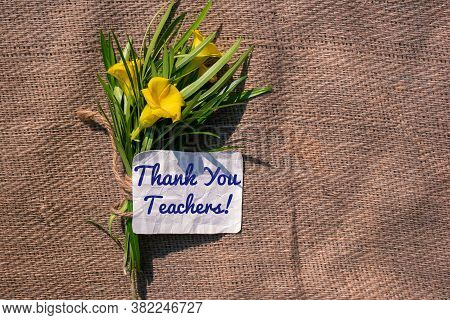 Thank You Teachers Note With Yellow Oleander Flowers On Burlap Fabric