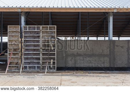 Concrete Formwork At A Construction Site. Installation Of Reinforced Concrete Building Walls