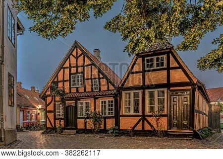 Two Yellow Half-timbered Houses In The Breaking Morning Light In The Small Town Faaborg, Denmark, Au