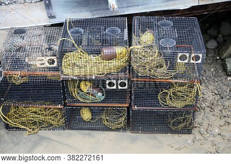Crab Traps. Fishing Crab Traps stacked and loaded ready to be set out at sea to catch crabs and shell fish. 