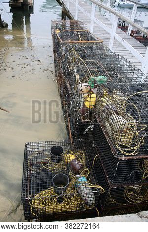 Crab Traps. Fishing Crab Traps stacked and loaded ready to be set out at sea to catch crabs and shell fish. 