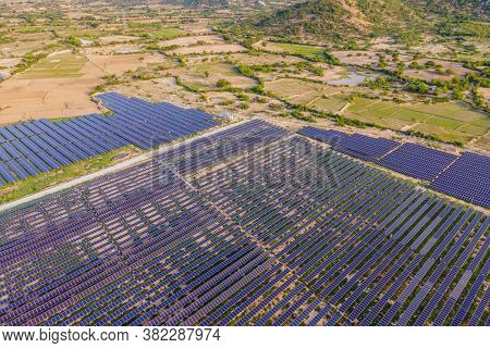 Aerial View Of The Solar Panel In Solar Farm For Green Energy
