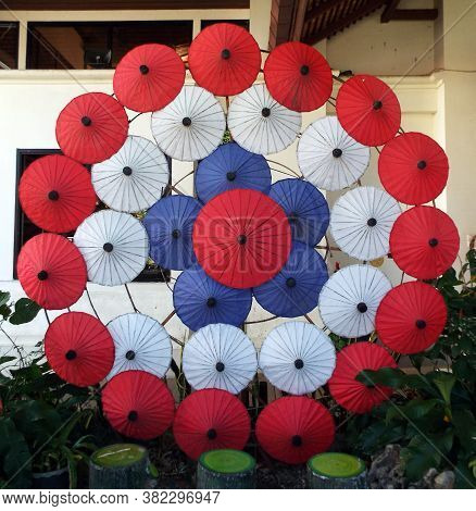 Bor Sang, Chiang Mai, Thailand, December 22, 2018: Colors Of The Thai Flag Made With Umbrellas At Th
