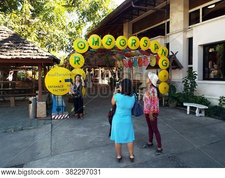 Bor Sang, Chiang Mai, Thailand, December 22, 2018: Three Women Take Photos At The Entrance To Bor Sa