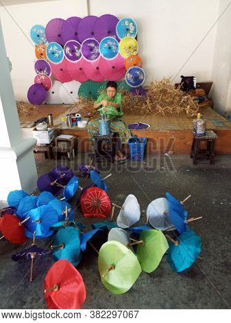 Bor Sang, Chiang Mai, Thailand, December 22, 2018: A Craftswoman Works On Making Umbrellas At The Bo