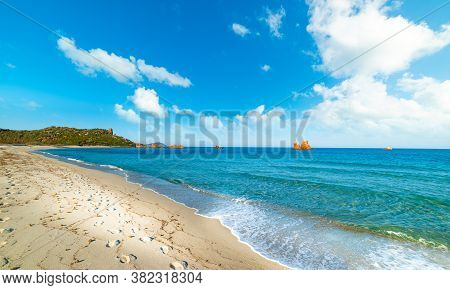 White Sand And Orange Sea Stacks In Cea Beach. Sardinia, Italy
