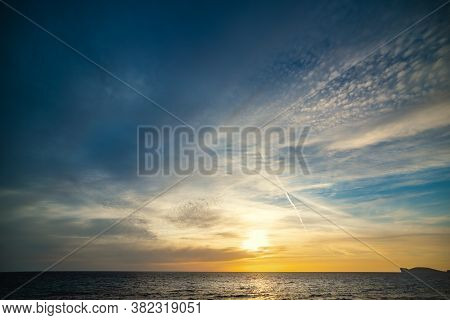 Cluody Sky Over The Sea At Sunset. Sardinia, Italy
