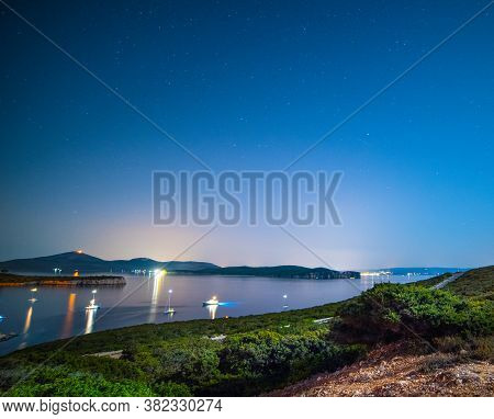 Starry Night Over Porto Conte Bay. Sardinia, Italy