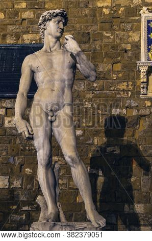 Nightshoot Portrait Of David Sculpture And Shadow In City Square In Florence