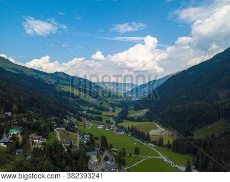 Aerial View From The Valley Head Of The Hinterglemm Mountains To Hinterglemm And Saalbach On A Summe