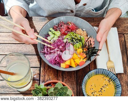 Woman Eating Tasty Colorful Healthy Natural Organic Vegetarian Hawaiian Poke Bowl Using Asian Chopst