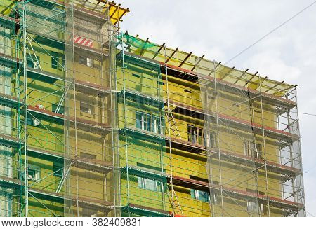 Scaffolding Arround The House To Install Thermal Insulation Of The Apartment Building Facade