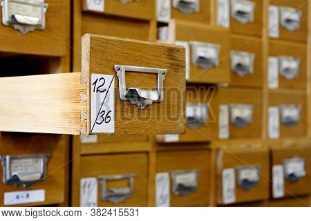 Library Catalogue Cards In Old Wooden Box. File Archive, Opened Drawer With Paper Documents, Databas