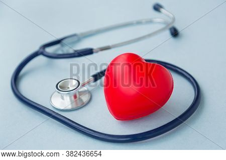 Red Heart With Heartbeat Or Heart Rate And Stethoscope On Blue Background. Medical And Health Care, 