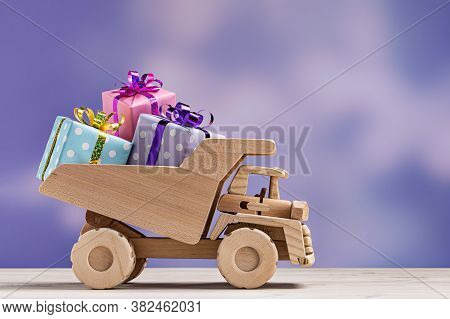 Toy Car With Gift Boxes In Festive Wrapper.