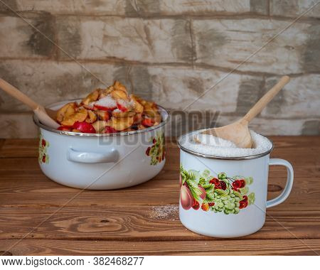 Preparing For Cooking Apple Jam, Sliced Apples And Sugar In An Enamel Bowl With Fruit Drawings On Th