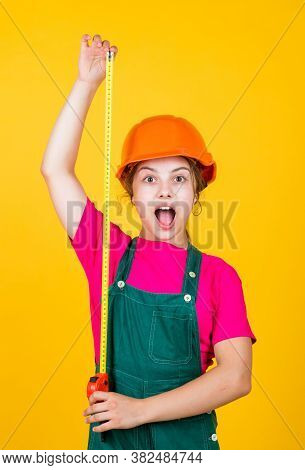 Cute Kid As A Construction Worker. Kid Repairing Home. Happy Childhood. Self-retracting Metal Tape M