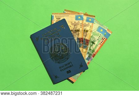 Kazakhstan Passport With National Money - Tenge On Green Background. Kz Passport And Kazakh Money Ba