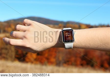 Woman With Smart Watch Checking Time Interval, Distance, Heart Rate And Burnt Calories Amount In Fit