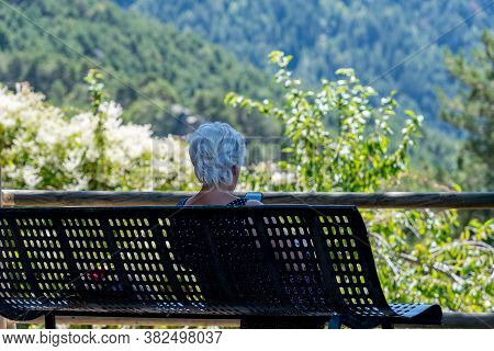Escaldes Engodany, Andorra : 20 August 2020 : Old Woman Whit Telephone In The Engolasters Lake In Es