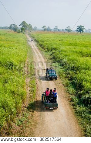 Kaziranga, Assam, India On 13 Nov 2014 - Tourists Enjoying Jeep Safari On The Muddy, Broken Road In 