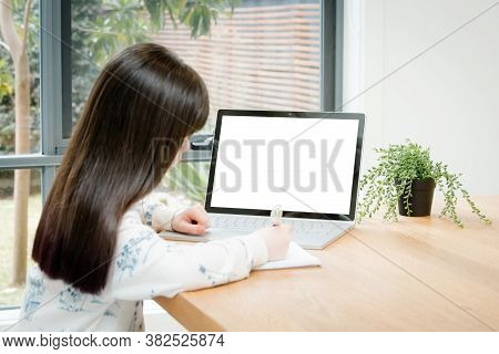 Placeit - Child Uses A Computer For School Work