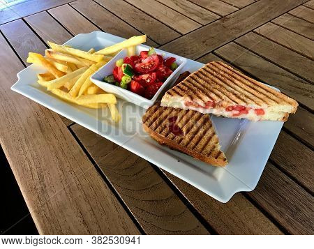 Turkish Fast Food Menu Toast With Salad And Potatoes / Club Sandwich Tost On Wooden Table.