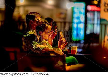 Odessa, Ukraine - Cirka 2020: Spectators At Concert In Theater Take Pictures Of Performance Of Their