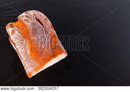 Frozen Raw Pork Neck Chops Meat Steak Isolated On Slate. Frozen Uncooked Slices Of Beef Steaks, Tend