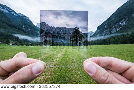 Professional Photographer Holding Nd Gradient Filter Glass Appreciating An Effect. Logar Valley, Slo