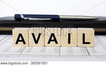 A Word Avail Written In A Wooden Cube With A Pen And Wallet