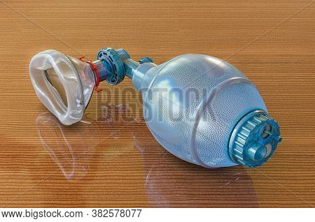 Ambu Bag For Ventilation Resuscitation On Wooden Table, 3d Rendering