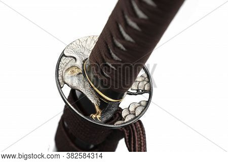 Tsuba : Hand Guard Of Japanese Sword Made Of Steel​  Isolated In White Background.  Selective Focus.