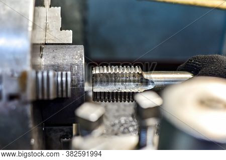 Tapping On A Lathe, The Tap Cuts The Hole By Applying Pressure From The Tailstock