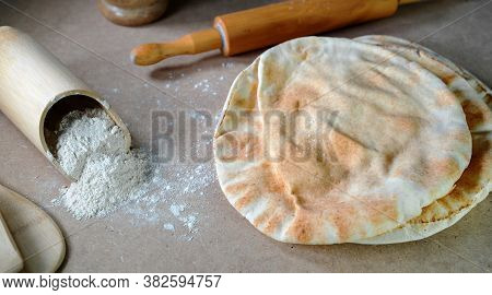 Kuboos Or Khubz - Arabic Bread On A Brown Table In The Kitchen Kitchen