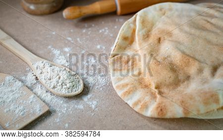 Kuboos Or Khubz - Arabic Bread On A Brown Table In The Kitchen Kitchen