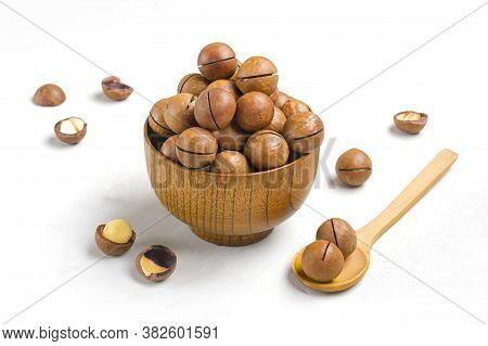 Natural Organic Macadamia Nuts In Wooden Bowl On Gray Concrete Background Flat Lay Top View Healthy 